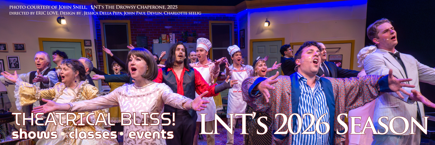 LNT's production of the Addams Family - Wednesday (foreground in black) 'tortures' Pugsley (held by ensemble posing as the machine)